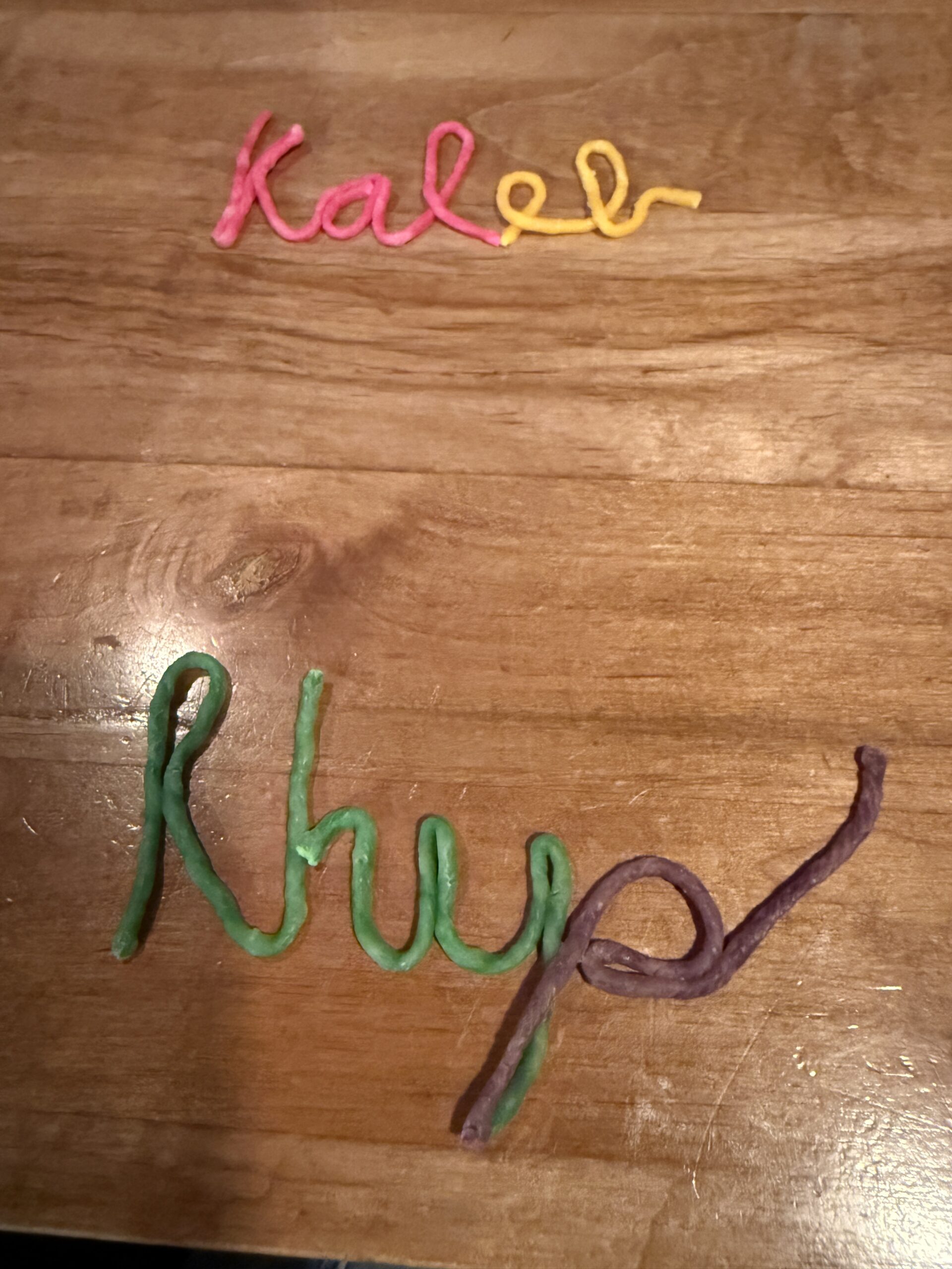 Children’s names formed in cursive with Wikki Stix for multisensory handwriting practice
